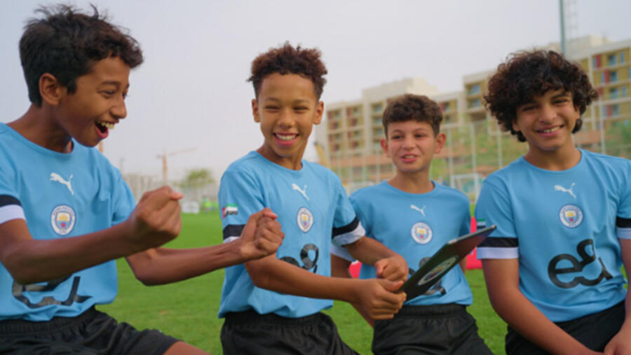 e& and manchester city surprise talented player programme participants with opportunity of a lifetime