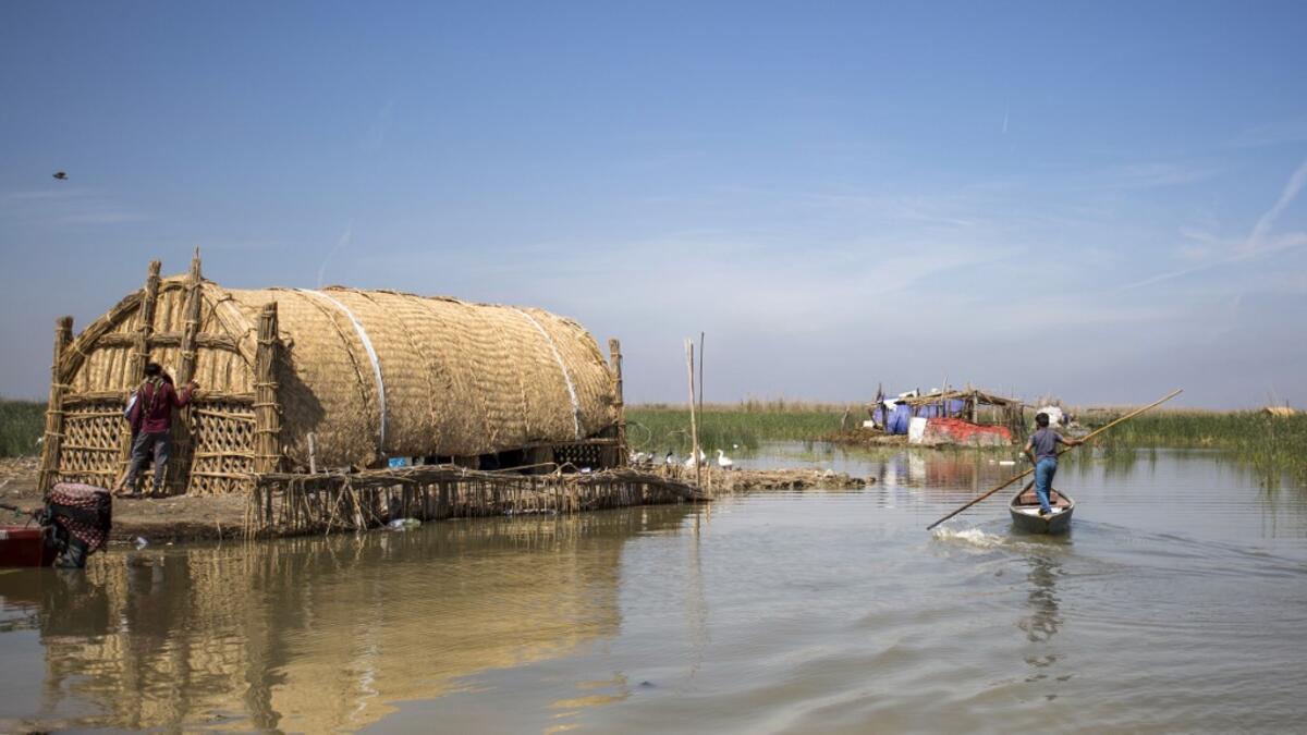 This picture taken on March 29, 2019 shows a floating palm reed-woven house for tourists in the marshes of the southern Iraqi district of Chibayish in Dhi Qar province, about 120 kilometres northwest of the southern city of Basra. Hussein FALEH / AFP