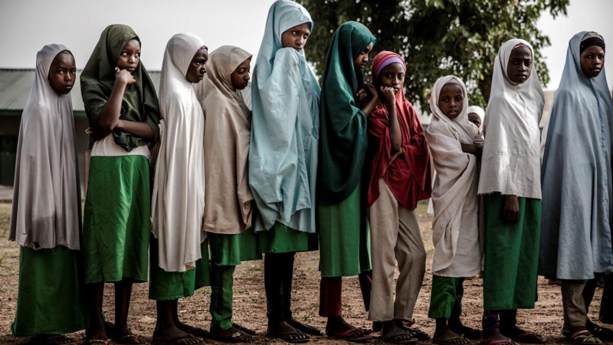 A group of Fulani students queue at the school grounds before the beginning of the day's lessons at Wuro Fulbe Nomadic School in Kacha Grazing Reserve for Fulani people, Kaduna State, Nigeria, on April 19, 2019. Luis TATO / AFP