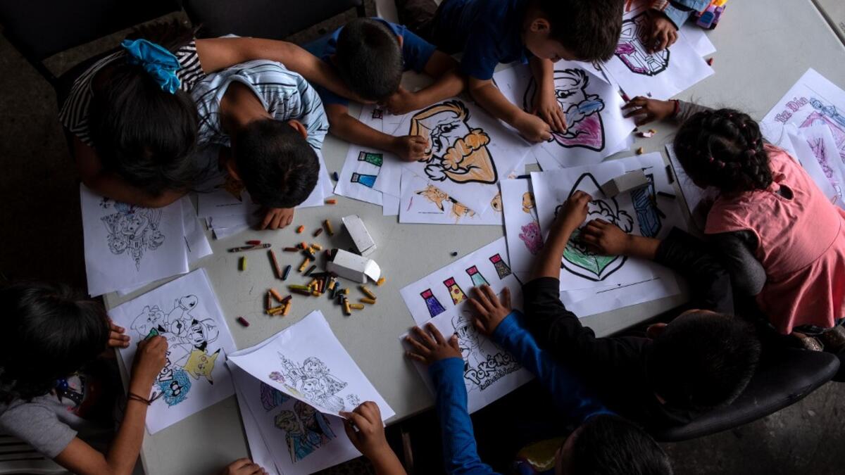 Minor migrants seeking for asylum in the United States draw in Juventud 2000 migrant shelter in Tijuana, Baja California state, on June 19, 2019, Mexico ahead of World Refugees Day. World Refugee Day is observed June 20 each year internationally to raise awareness of the situation of refugees throughout the world.  (Guillermo Arias / AFP)