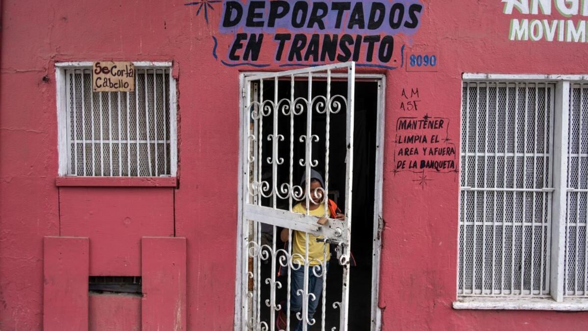 A migrant girl walks out of the Juventud 2000 II shelter in Tijuana, Baja California state, on June 19, 2019, Mexico ahead of World Refugees Day. World Refugee Day is observed June 20 each year internationally to raise awareness of the situation of refugees throughout the world.  (Guillermo Arias / AFP)