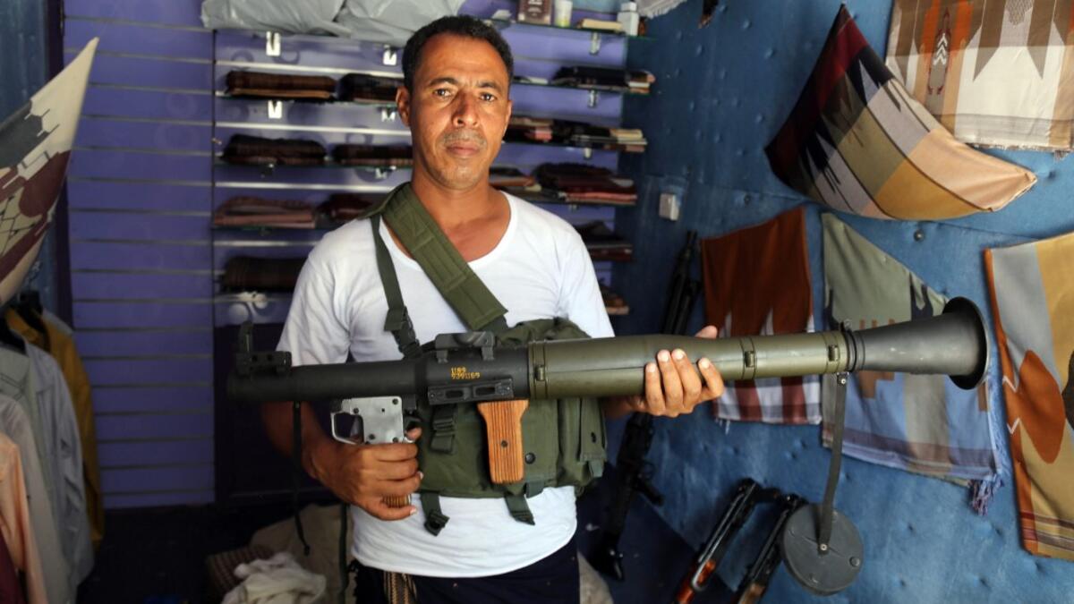 Today, more than four years after the Houthi rebels began their siege on Yemen's third largest city, bullets and guns have taken over the market. AHMAD AL-BASHA / AFP