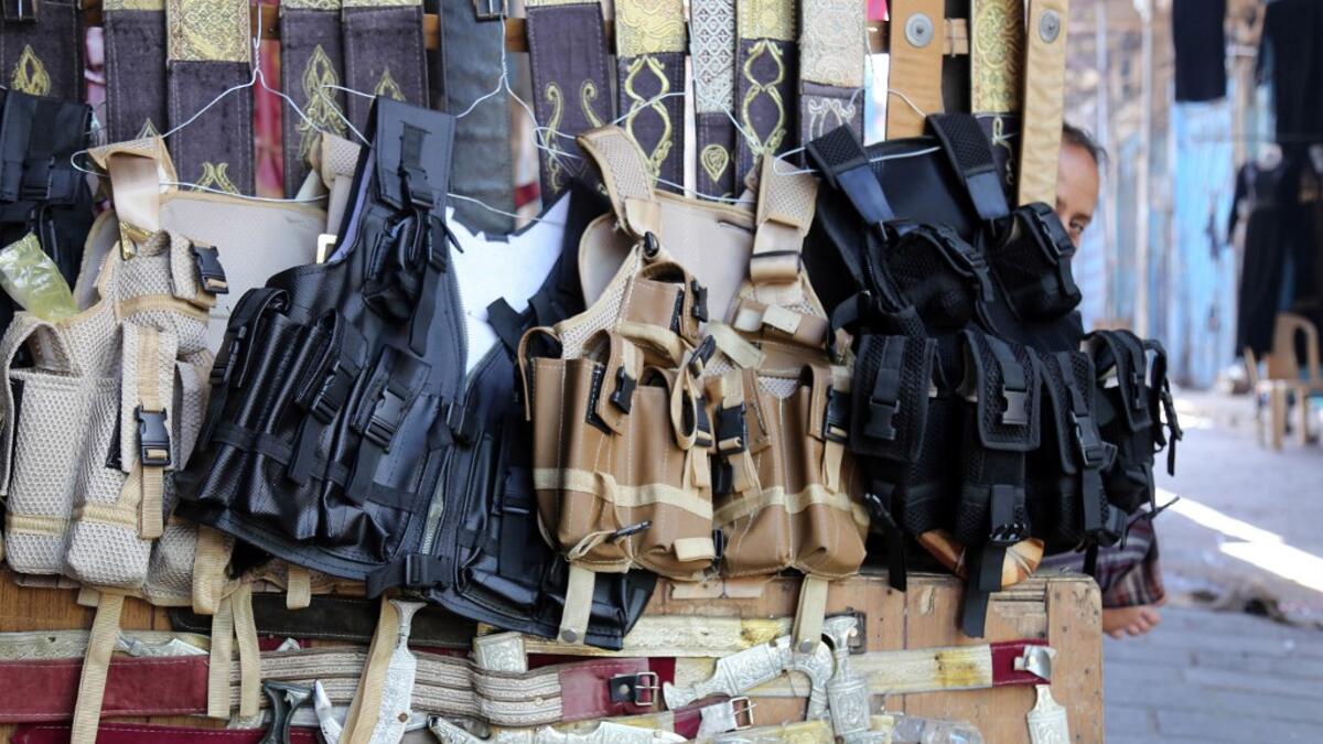 Tactical vests are pictured on display at a shop in Yemen's third city of Taez, on July 13, 2019. Before the war, the old market of Taez was crowded with people and was full of handcrafts and artisanal goods. AHMAD AL-BASHA / AFP