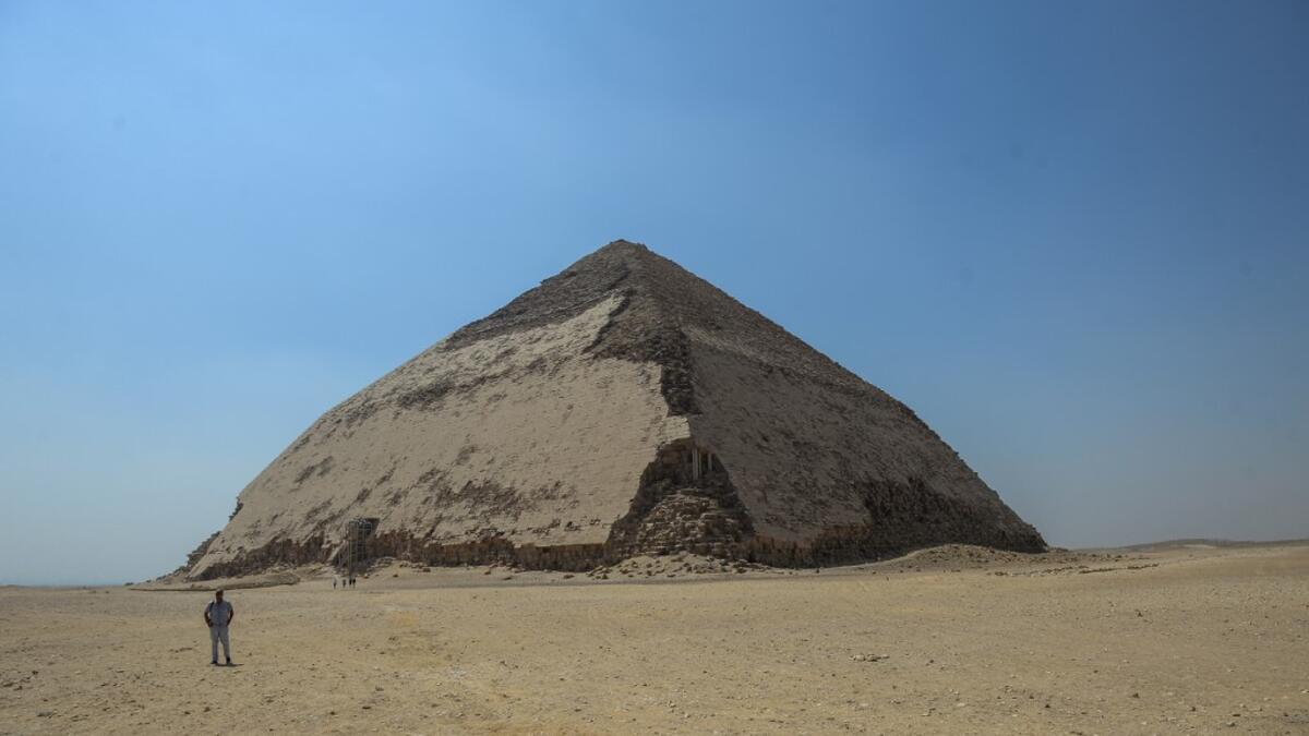 A picture taken on July 13, 2019 shows the Bent pyramid of King Sneferu, the first pharaoh of Egypt's 4th dynasty, in the ancient royal necropolis of Dahshur on the west bank of the Nile River, south of the capital Cairo. Mohamed el-Shahed / AFP