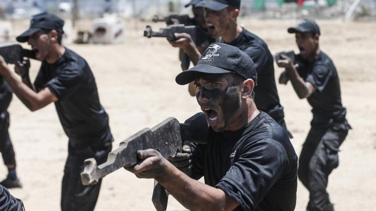 Palestinian military cadets take part in a training session organised by Hamas' military wing, the Ezzedin al-Qassam Brigades, in Gaza City on July 20, 2019.  MAHMUD HAMS / AFP