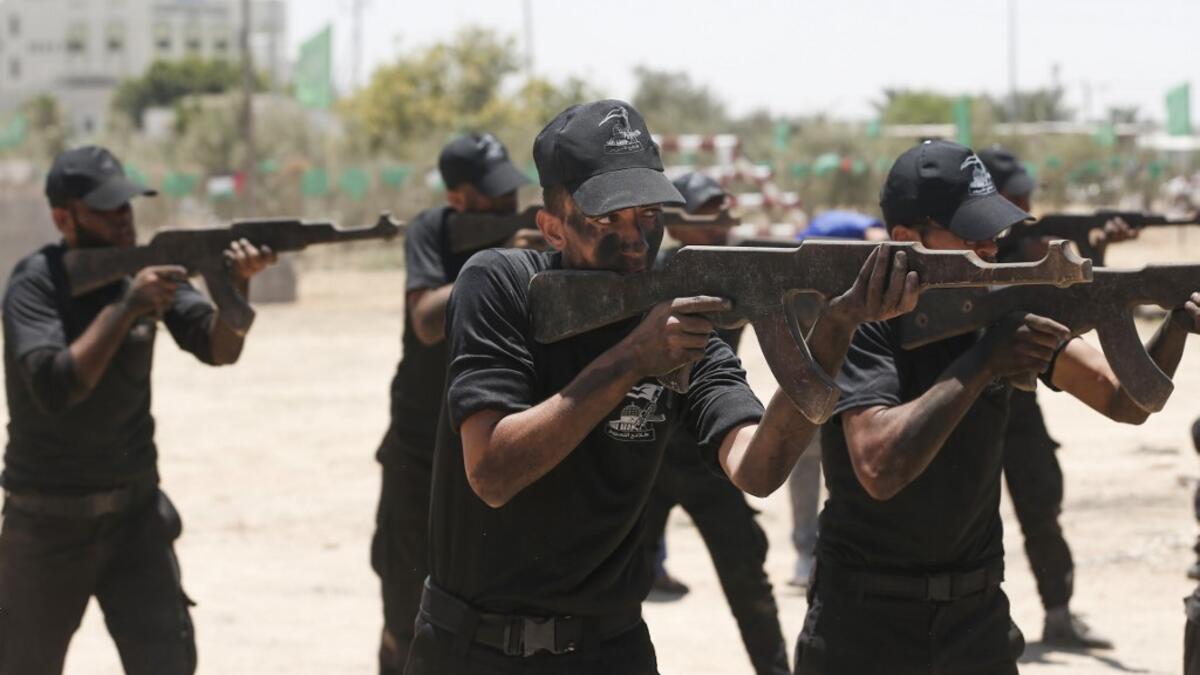 Palestinian military cadets take part in a training session organised by Hamas' military wing, the Ezzedin al-Qassam Brigades, in Gaza City on July 20, 2019.  MAHMUD HAMS / AFP