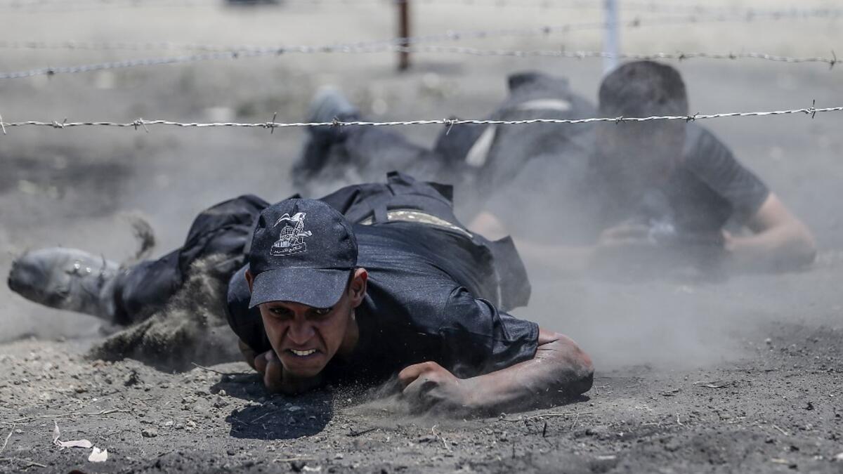 Palestinian military cadets take part in a training session organised by Hamas' military wing, the Ezzedin al-Qassam Brigades, in Gaza City on July 20, 2019.  MAHMUD HAMS / AFP