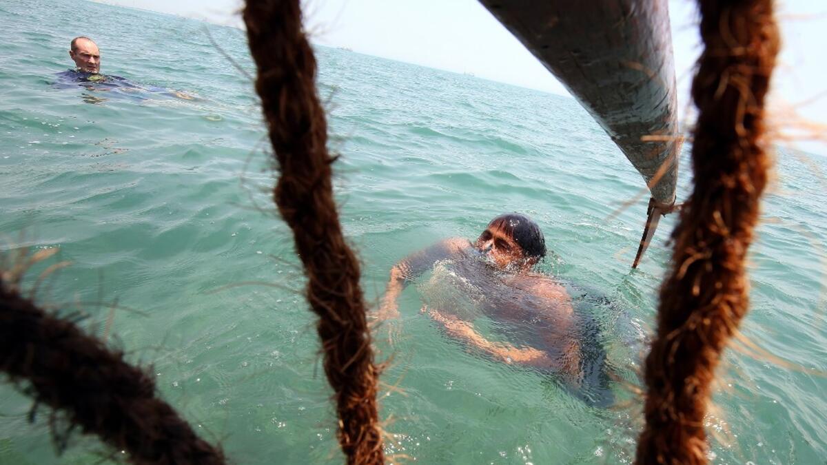 Pearl-diving trips are held annually under the patronage of the Kuwaiti emir in order to keep alive traditions that accompanied the once important national trade of pearl diving, prior to the discovery of oil. Yasser Al-Zayyat / AFP