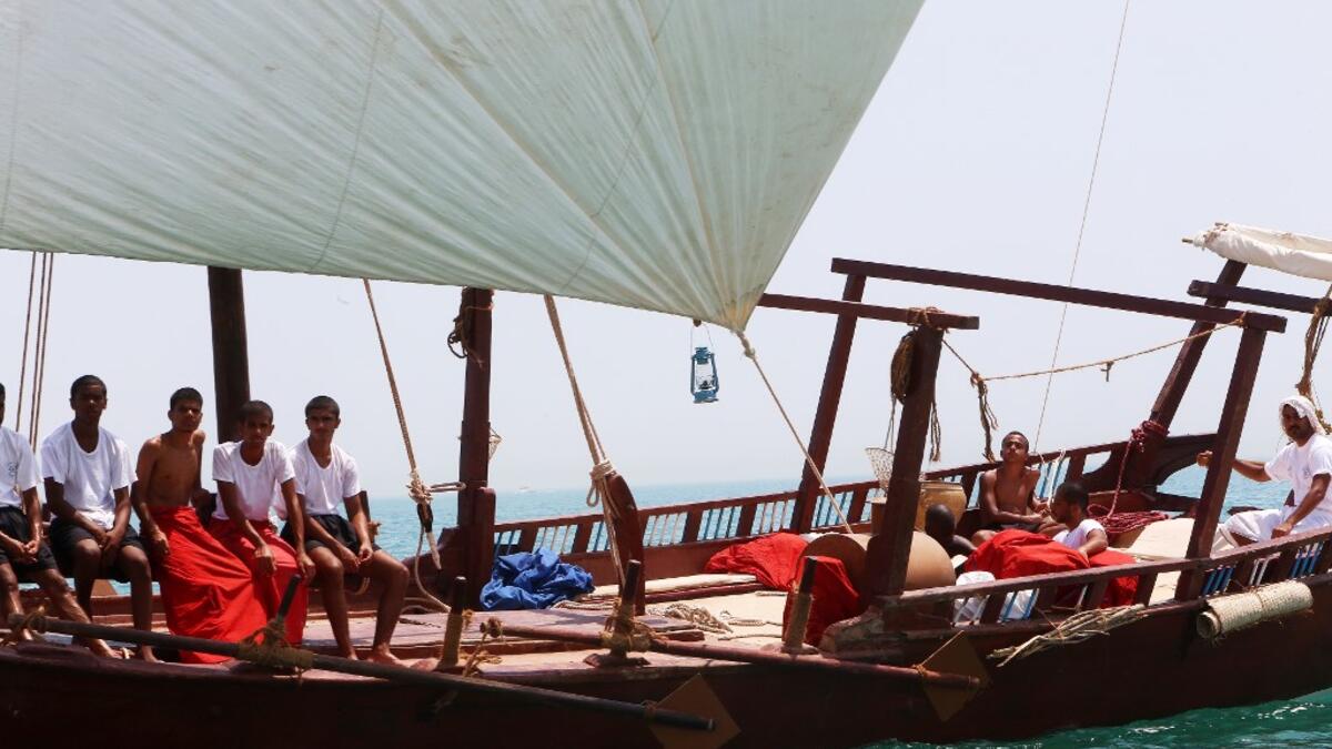 A Kuwaiti diver searches for shells containing pearls during the annual pearl diving season on July 30, 2019 off the coast of the port city of Khairan, 100 kms (62miles) south of Kuwait City Yasser Al-Zayyat / AFP
