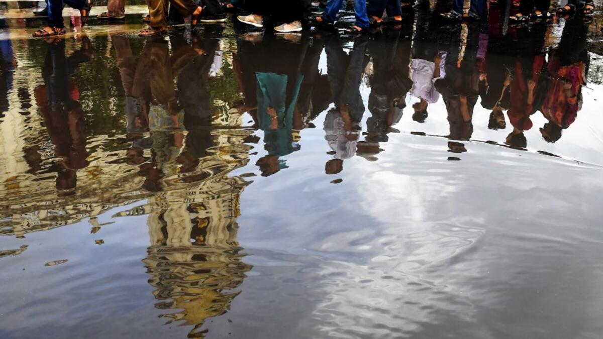 Protestors and social activists take part in a protest in Kolkata on August 6, 2019, in reaction to the Indian government scrapping Article 370 that granted a special status to Jammu and Kashmir.  Dibyangshu SARKAR / AFP