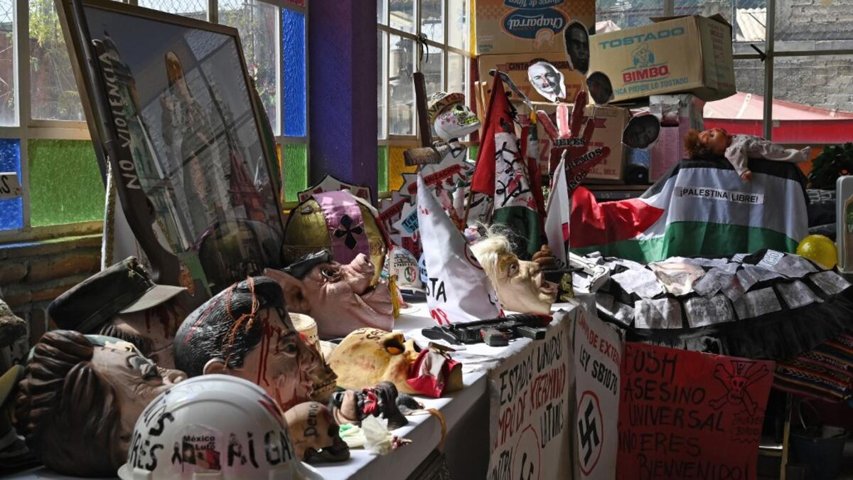 View of parts of objects used by Mexican activist Julia Klug in protests, including a flag reading "Free Palestine" in Mexico City on August 08, 2019. RODRIGO ARANGUA / AFP
