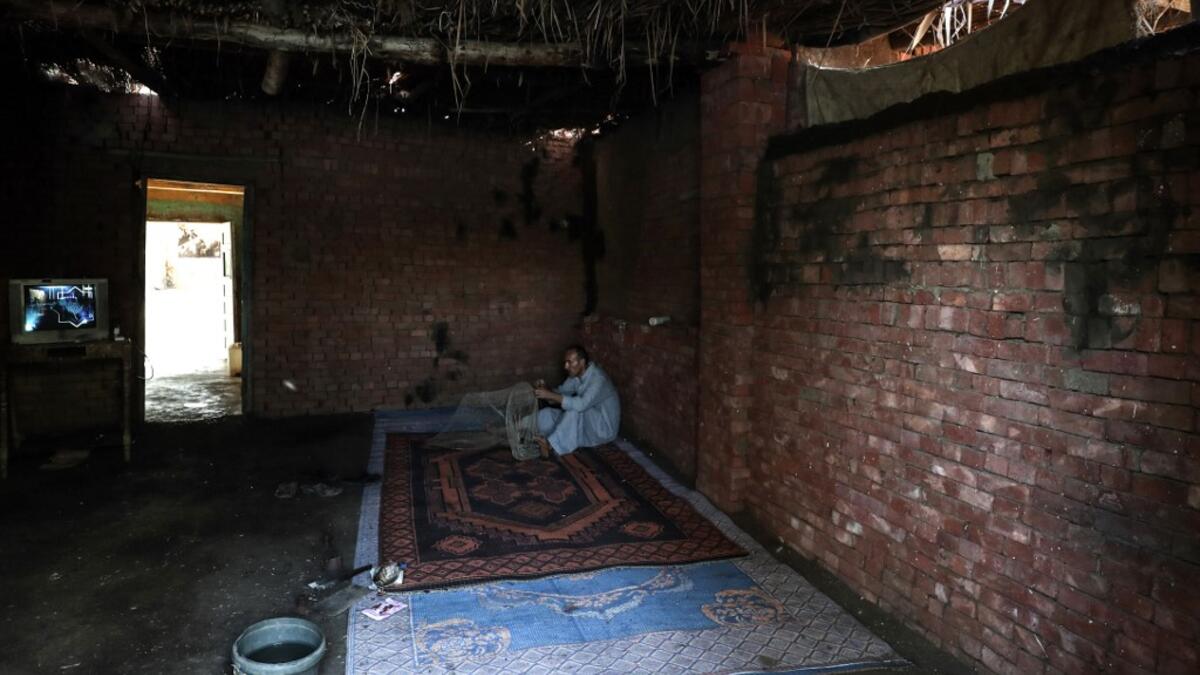 An Egyptian Fisherman handles a net before fishing in the waters of the Pharaonic Sea in the village of Kafr Fisha, province of Monufia, on August 13, 2019. Mohamed el-Shahed / AFP