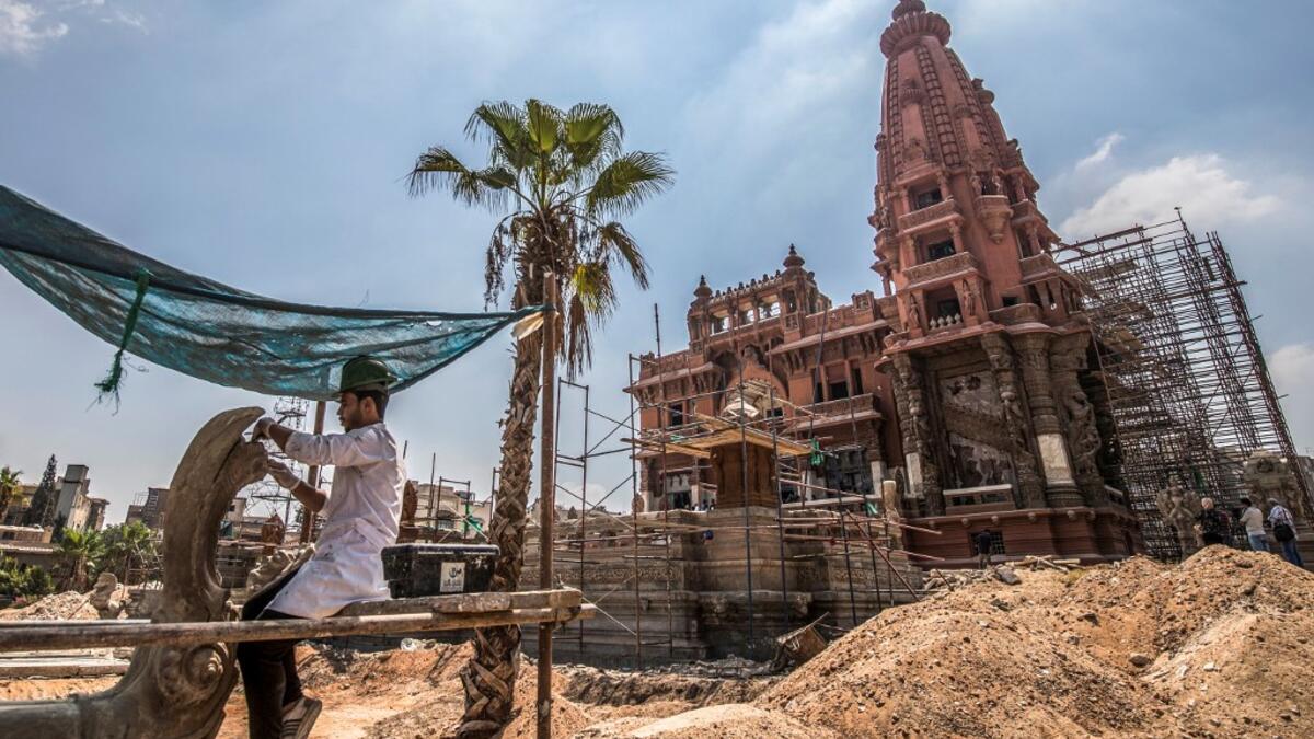 This picture taken on August 18, 2019 shows restoration works ongoing at the historic "Le Palais Hindou" (also known as the "Baron Empain Palace") built by in the early 20th century by Belgian industrialist Edouard Louis Joseph, Baron Empain, in the classical Khmer architectural style of Cambodia's Angkor Wat, in the Egyptian capital Cairo's northeastern Heliopolis district.  Khaled DESOUKI / AFP