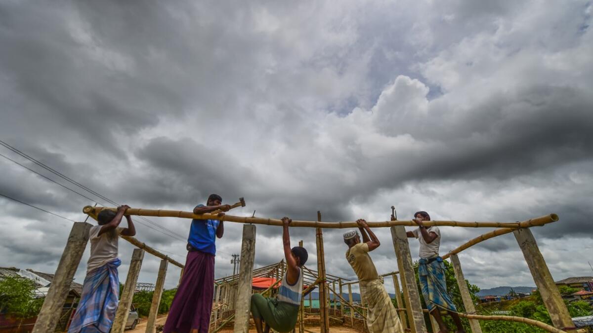 Rohingya refugees build a makeshift office at Kutupalong refugee camp in Ukhia district on August 23, 2019.  MUNIR UZ ZAMAN / AFP