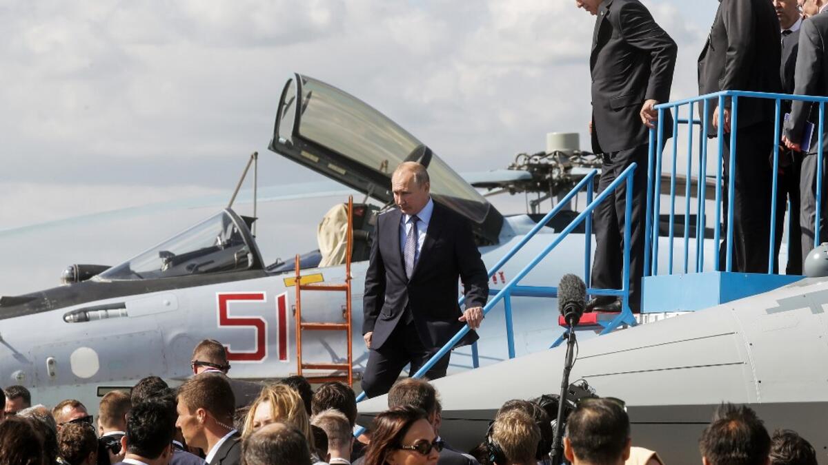Russian President Vladimir Putin (C) and his Turkish counterpart Recep Tayyip Erdogan (R) inspect Sukhoi Su-57 fifth-generation fighter during the MAKS-2019 International Aviation and Space Salon opening ceremony in Zhukovsky outside Moscow on August 27, 2019.  Maxim SHIPENKOV / POOL / AFP