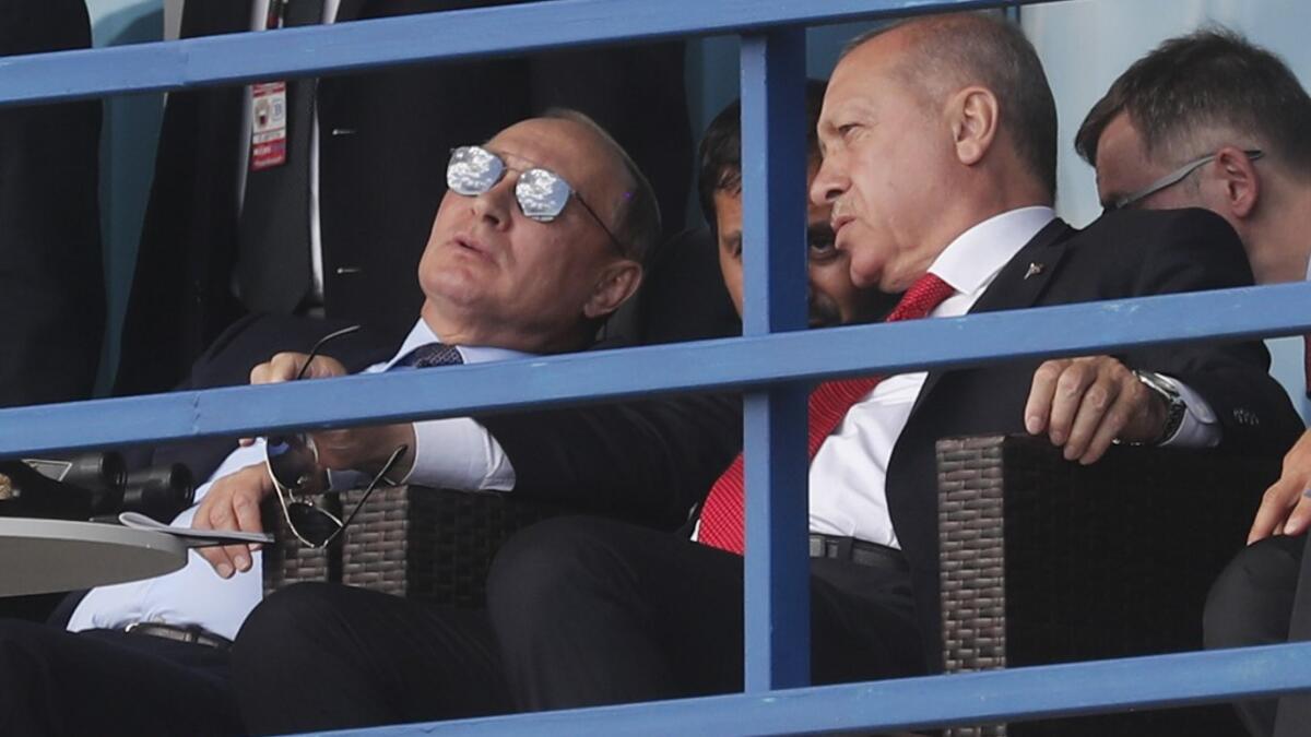 Russian President Vladimir Putin (L) and Turkish President Recep Tayyip Erdogan (R) watch demonstration flights at the MAKS-2019 International Aviation and Space Salon opening day in Zhukovsky outside Moscow on August 27, 2019.  Maxim SHIPENKOV / POOL / AFP