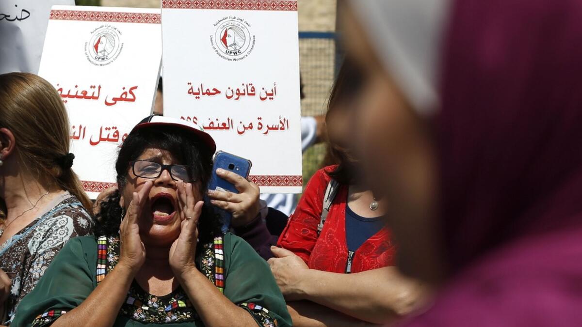Palestinian women protest in support of women’s rights outside the prime minister’s office in the West Bank city of Ramallah on September 2, 2019, after a young Palestinian died in a case that has raised emotions.  ABBAS MOMANI / AFP