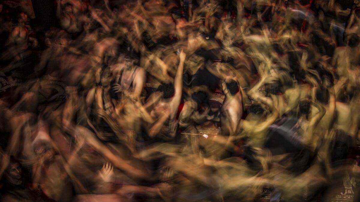 Iraqi Shiite Muslims take part in commemorations marking the 8th day of Muharram ahead of Ashura, in the southern city of Basra. Hussein FALEH / AFP