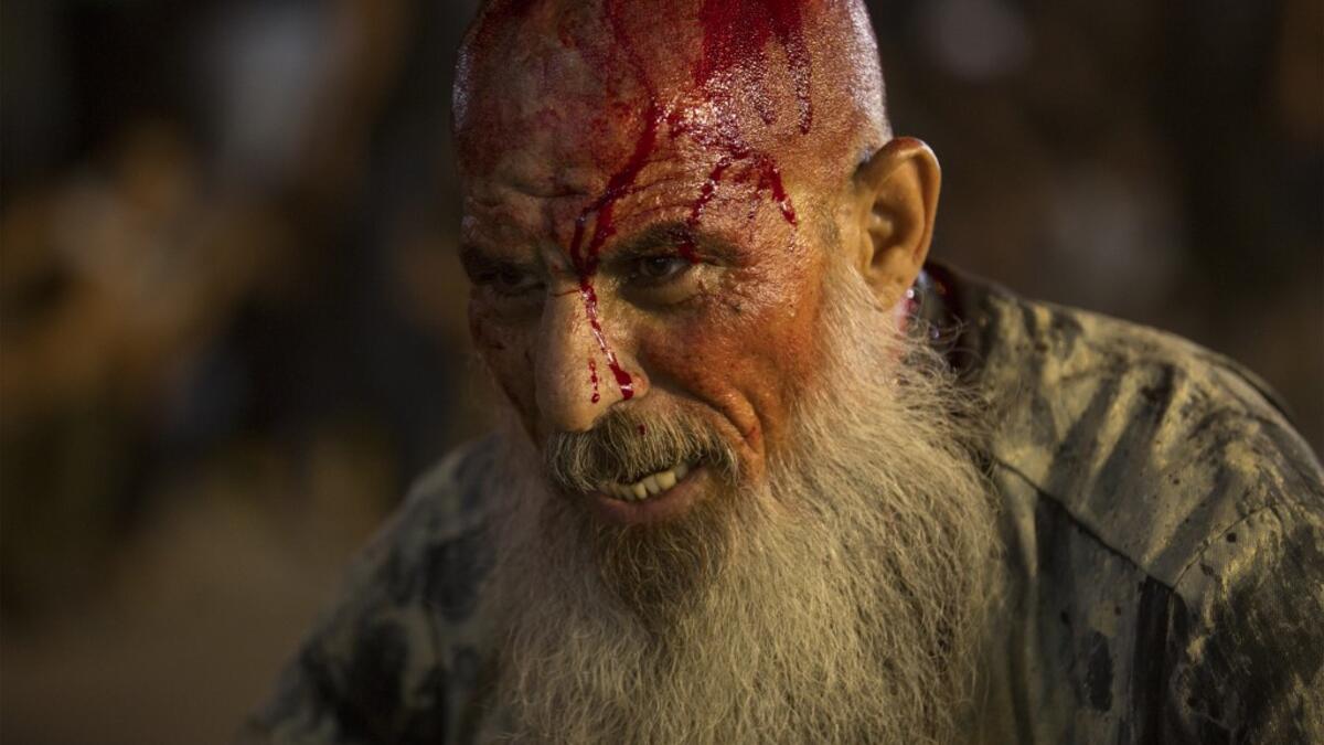 An Iraqi Shiite Muslim covered with blood takes part in commemorations marking the 8th day of Muharram ahead of Ashura , in the southern city of Basra. Hussein FALEH / AFP