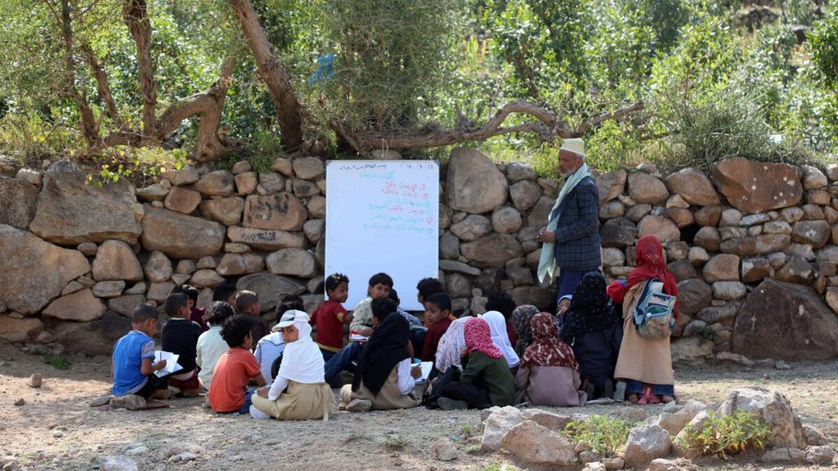 The classes are given in a field outside the school which was under construction but was never completed when funding was stopped due to the war that broke out in Yemen in 2015. AHMAD AL-BASHA / AFP