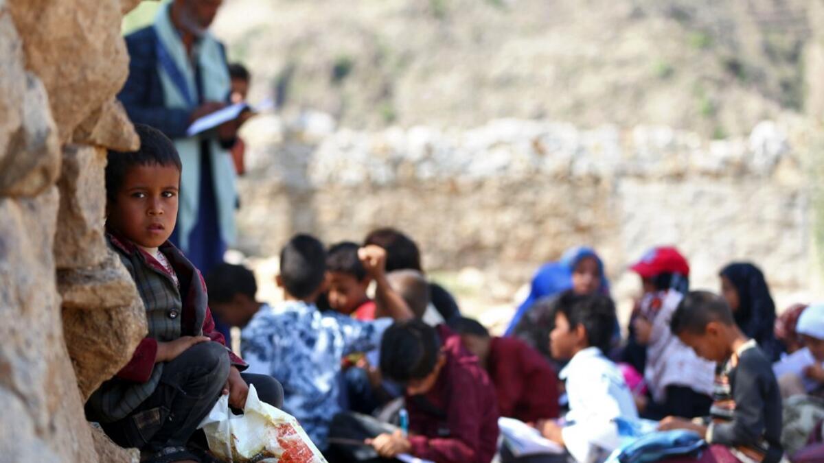 Yemeni school children attend an open-air class at their unfinished school in Yemen Ahmad AL-BASHA / AFP