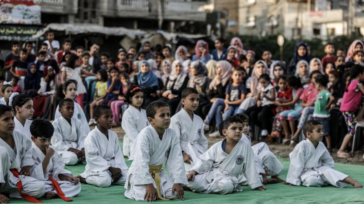 Young Palestinian karatekas attend a Karate promotion ceremony at a sporting centre in the Rafah camp for Palestinian refugees in the southern Gaza Strip on September 20, 2019. SAID KHATIB / AFP