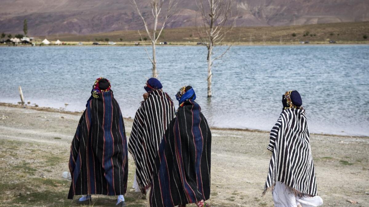 Amazigh (Berber) women arrive to take part in the annual "Engagement Moussem" festival near the village of Imilchil in central Morocco's high Atlas Mountains on September 21, 2019. Each year in the High Atlas Mountains hamlet of Ait Amer, tribes celebrate with dances and music, the collective wedding of young Amazigh couples during the traditional festival of "Engagement Moussem". FADEL SENNA / AFP