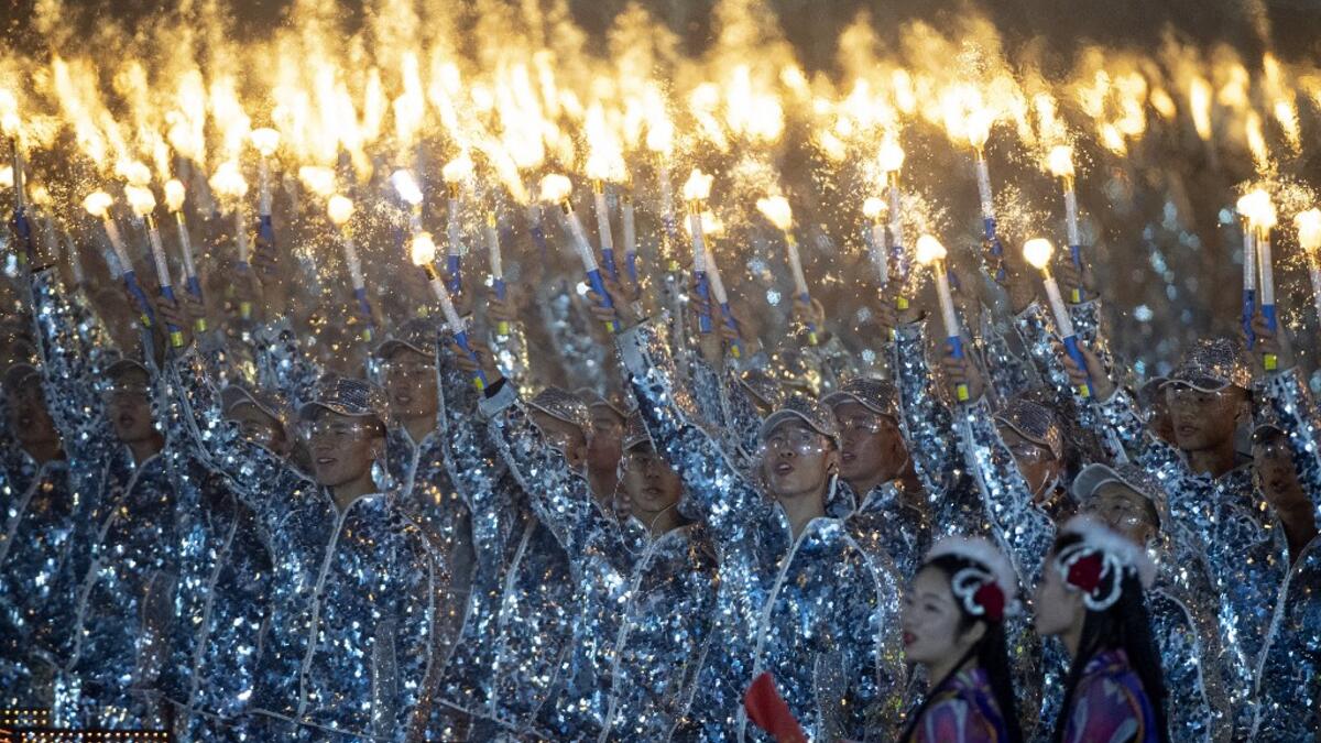 Chinese performers dance at a gala in Tiananmen Square in Beijing on October 1, 2019, to mark the 70th anniversary of the founding of the People’s Republic of China. NOEL CELIS / AFP