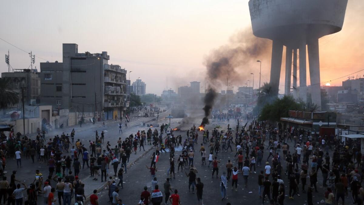Iraqi protesters gather during a demonstration against state corruption, failing public services and unemployment at Tayaran square in Baghdad on October 2, 2019. Iraq's president and the United Nations urged security forces to show restraint after two protesters were killed in clashes with police that other top officials blamed on "infiltrators." AHMAD AL-RUBAYE / AFP