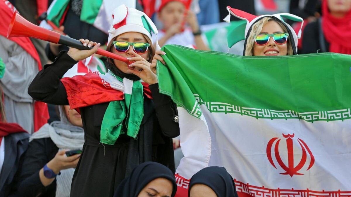 The Islamic republic has barred female spectators from football and other stadiums for around 40 years, with clerics arguing they must be shielded from the masculine atmosphere and sight of semi-clad men. Women fans are attending the football match freely for the first time in decades, after FIFA threatened to suspend the country over its controversial male-only policy.  ATTA KENARE / AFP