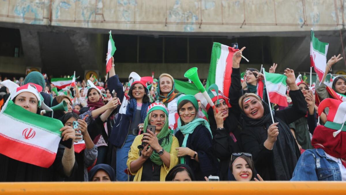 The Islamic republic has barred female spectators from football and other stadiums for around 40 years, with clerics arguing they must be shielded from the masculine atmosphere and sight of semi-clad men. Women fans are attending the football match freely for the first time in decades, after FIFA threatened to suspend the country over its controversial male-only policy.  ATTA KENARE / AFP