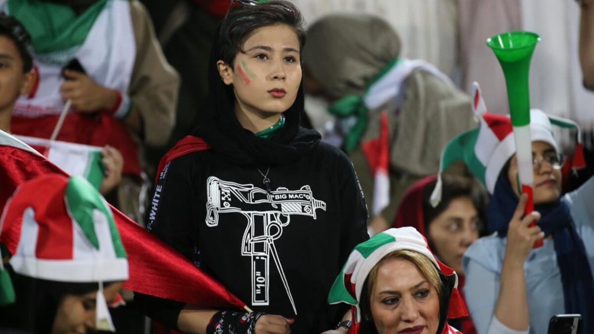 Iranian women look on during the World Cup Qatar 2022 Group C qualification football match between Iran and Cambodia at the Azadi stadium in the capital Tehran on October 10, 2019. ATTA KENARE / AFP