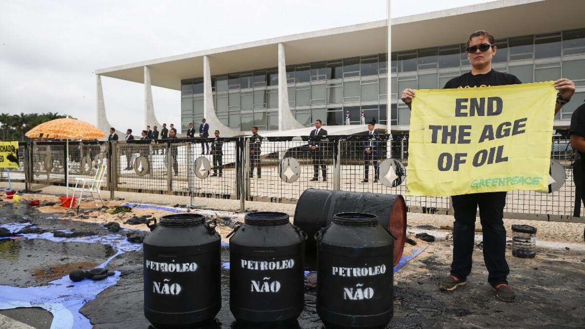 Greenpeace activists demonstrate in front of Planalto Palace in Brasilia, Brazil, Wednesday, October 23, 2019. Sérgio Lima / AFP