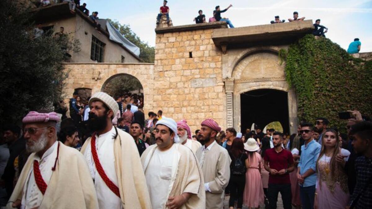 Yezidi women and men work Voluntarily to serve this holy site (Twitter)
