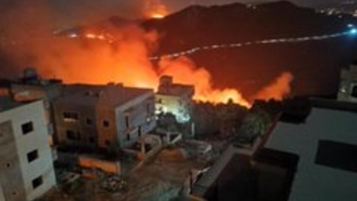 Interior Minister Raya El Hassan visited the site of the fire and spoke about the issue. “There is fear and caution in the firefighting because of the landmines,” she told reporters. (Twitter)