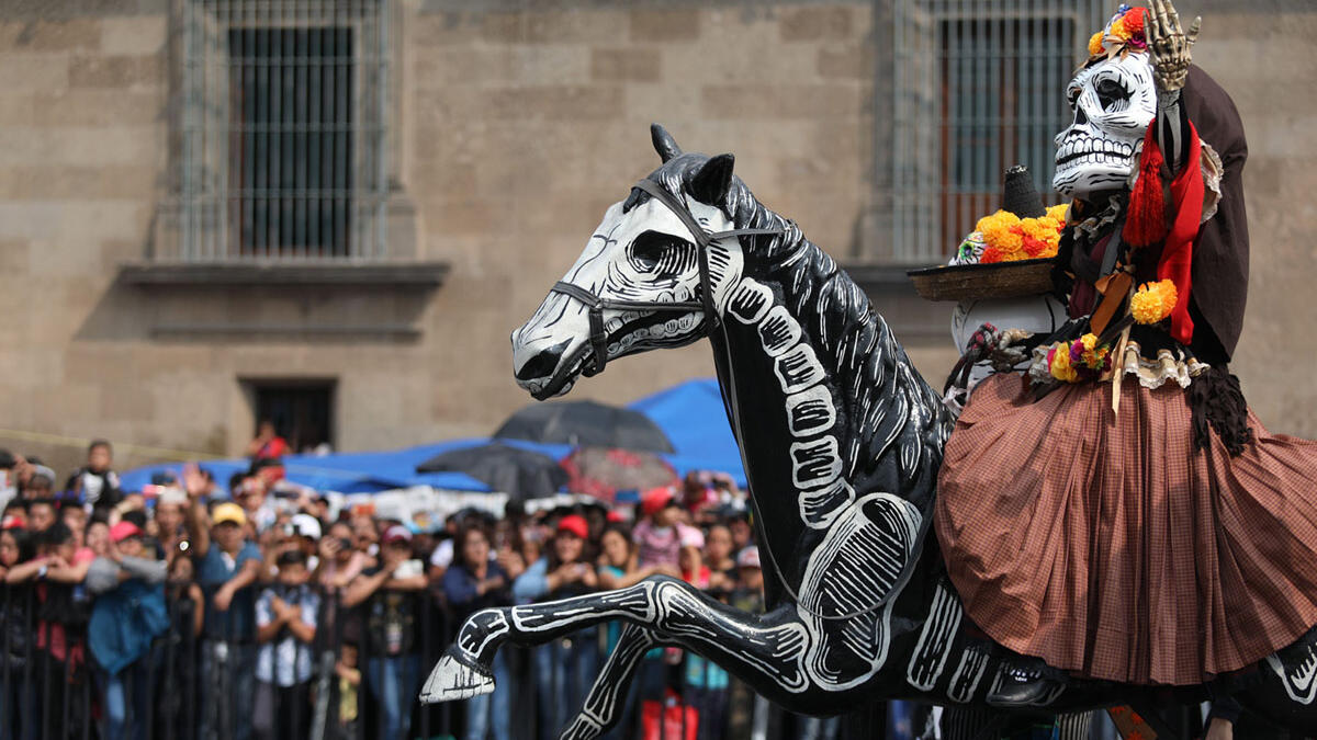 Participants in costume perform during the annual International Day of the Dead Parade in Mexico City  Emilio Espejel / Anadolu Agency / Getty