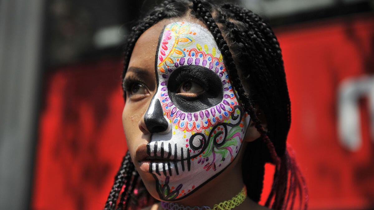 A woman dressed as Catrina takes part in the Catrinas Parade along Reforma Avenue in Mexico City  Claudio Cruz / AFP / Getty