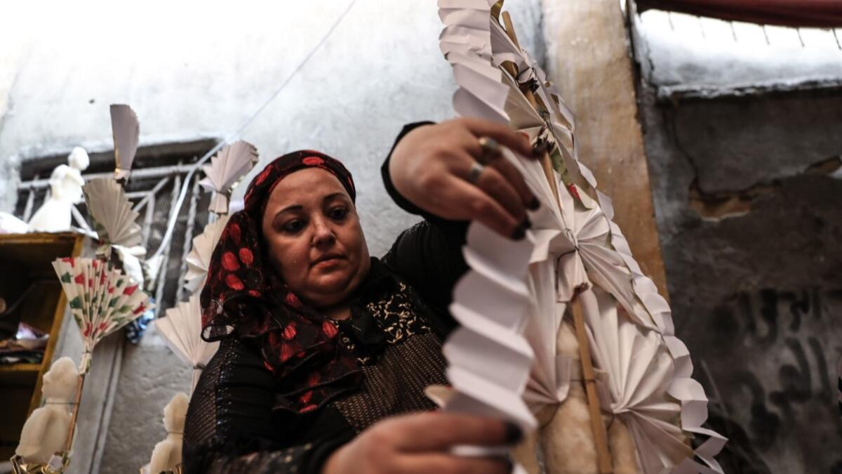 An Egyptian woman decorates traditional sugar statuettes in the capital Cairo on November 2, 2019, ahead of celebrations of the Muslim Prophet Mohammed's birthday, known as "Al Mawlid Al Nabawi". Prophet Mohamed was born in Saudi Arabia's arid mountainous city of Mecca, the holiest in Islam, some 1490 years ago. Sunni Muslims in many parts of the world celebrate his birthday on the 12th day of the third month of the Islamic calendar, which will fall this year on November 9th.  Mohamed el-Shahed / AFP