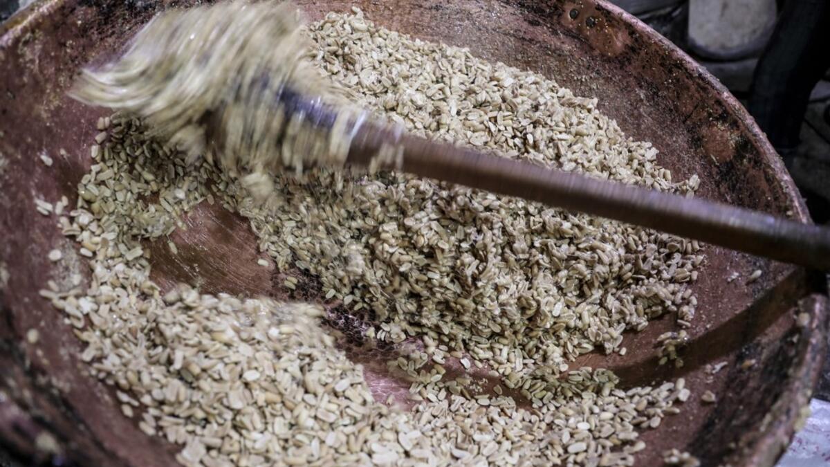 Peanuts are mixed eith melted sugar to make sweets at a candy factory in the capital Cairo on November 2, 2019, ahead of celebrations of the Muslim Prophet Mohammed's birthday, known as "Al Mawlid Al Nabawi". Prophet Mohamed was born in Saudi Arabia's arid mountainous city of Mecca, the holiest in Islam, some 1490 years ago. Sunni Muslims in many parts of the world celebrate his birthday on the 12th day of the third month of the Islamic calendar, which will fall this year on November 9th.  Mohamed el-Shahed