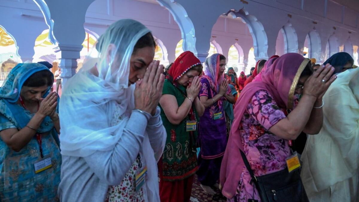 Sikh pilgrims pray at a shrine in Nankana Sahib, some 75 kms west of Lahore on November 7, 2019, on the occasion of the 550th birth anniversary of Guru Nanak Dev. A corridor that will allow Sikhs to cross from India into Pakistan to visit one of the religion's holiest sites is set to open on November 9, with thousands expected to make a pilgrimage interrupted by decades of conflict. Arif ALI / AFP