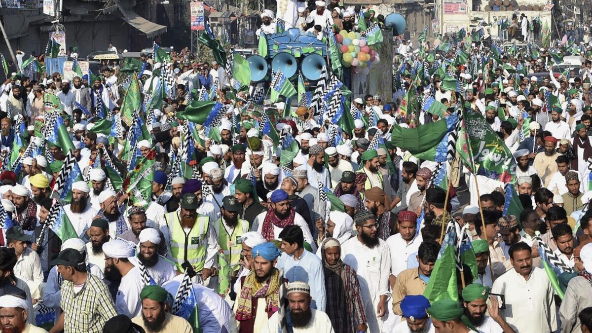 Muslim devotees take part of a procession to celebrate the birthday of Prophet Mohammed, in Lahore on November 10, 2019. The birthday of Prophet Mohammed, also known as 'Milad', is celebrated during the Islamic month of Rabi al-Awwal, which falls on 12 Rabi al-Awwal in Islamic calendar. Arif ALI / AFP