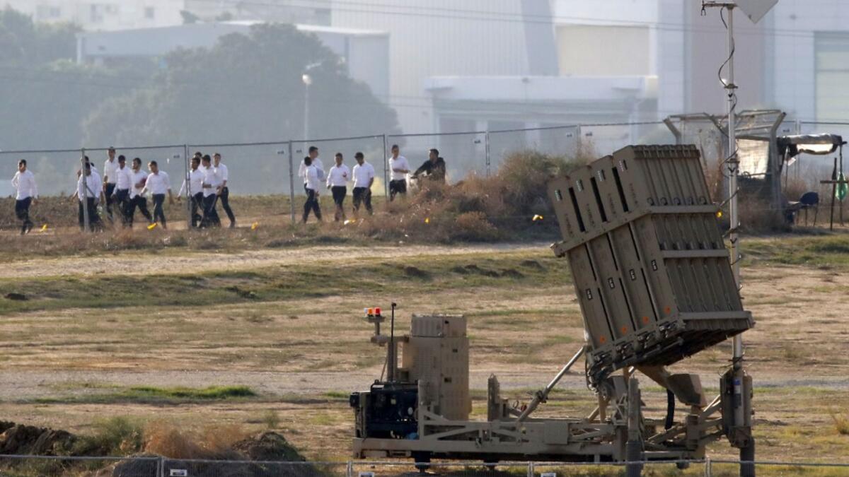 Israel's military killed a commander for Palestinian militant group Islamic Jihad in a strike on his home in the Gaza Strip, prompting retaliatory rocket fire and fears of a severe escalation in violence. JACK GUEZ / AFP