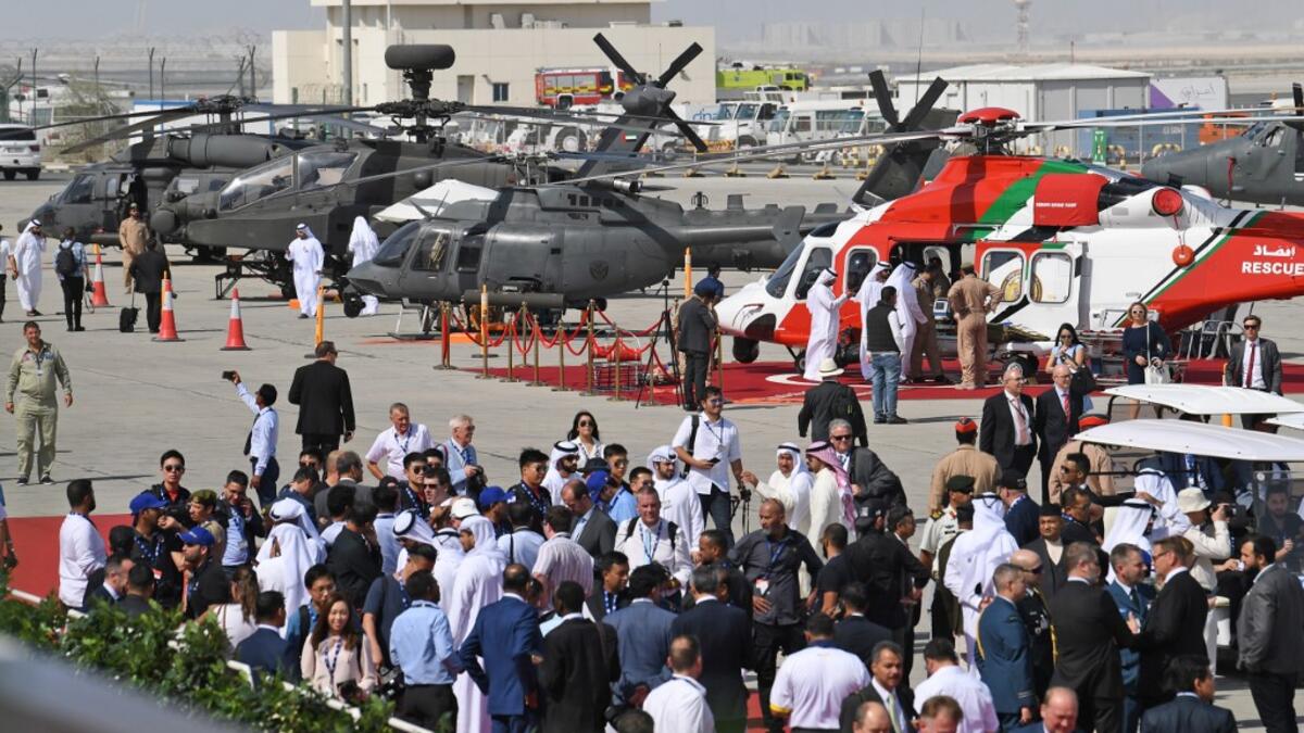 People attend the Dubai Airshow on November 18, 2019. KARIM SAHIB / AFP