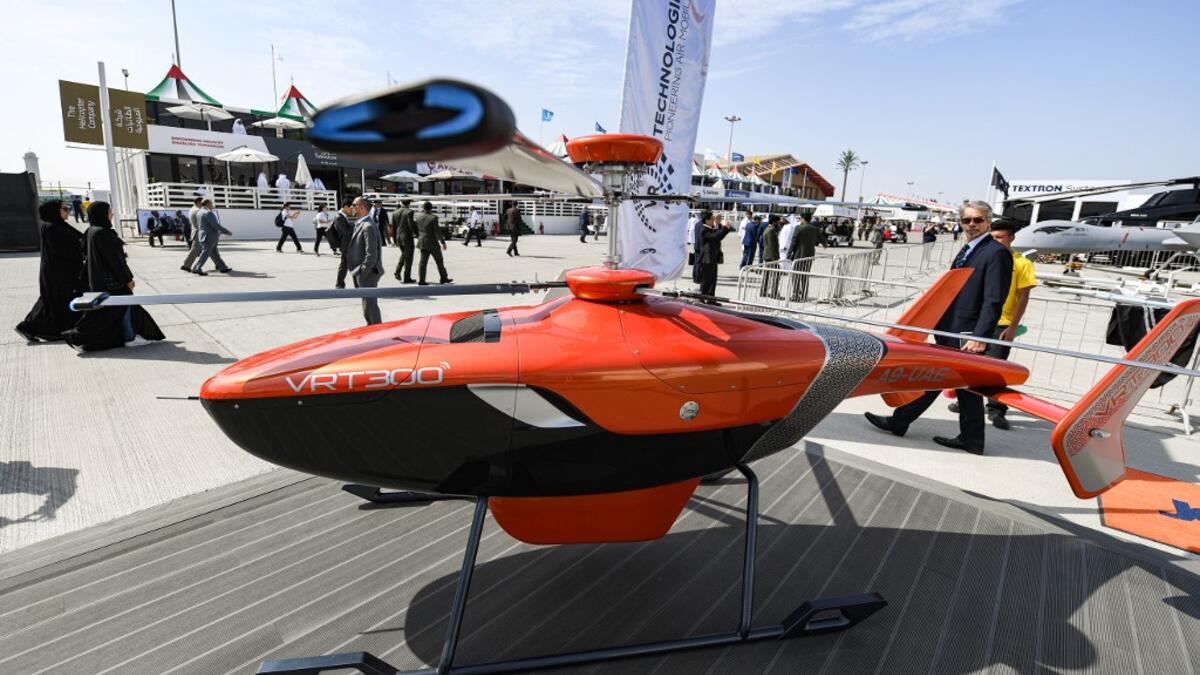This picture taken on November 18, 2019 shows a view of a Russian Helicopters VRT 300 twin coaxial rotor unmanned helicopter on display during the 2019 Dubai Airshow. KARIM SAHIB / AFP