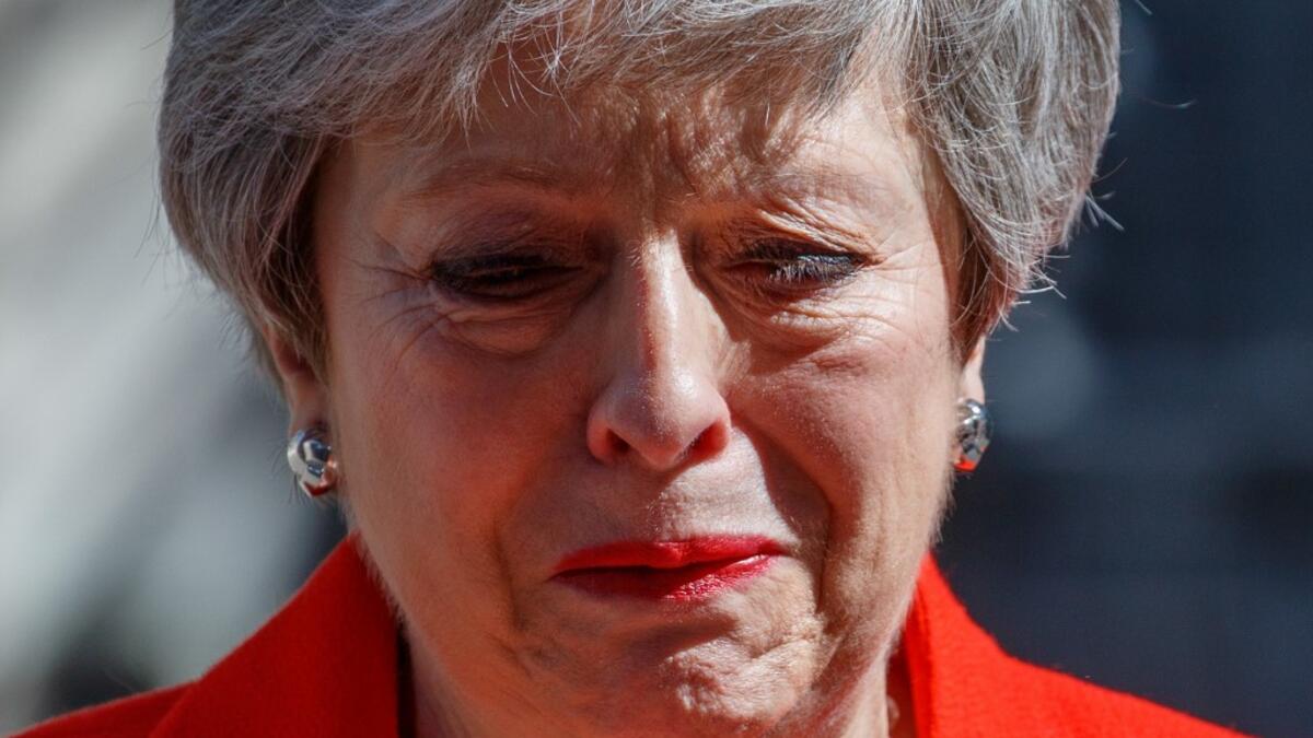 Britain's Prime Minister Theresa May reacts as she announces her resignation outside 10 Downing street in central London on May 24, 2019. Beleaguered British Prime Minister Theresa May announced on Friday that she will resign on June 7, 2019 following a Conservative Party mutiny over her remaining in power. Tolga AKMEN / AFP