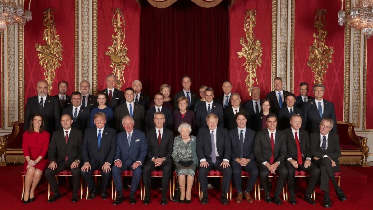 Leaders of Nato alliance countries, and its secretary general, join Queen Elizabeth II and the Prince of Wales for a group picture to mark 70 years of the alliance. Back row, from left: Xavier Bettel, Prime Minister of Luxembourg; Egils Levits, President of Latvia; Gitanas Nauseda, President of Lithuania; Dusko Markovic, Prime Minister of Montenegro; Erna Solberg, Prime Minister of Norway; Mark Rutte, Prime Minister of Netherlands; Zuzana Caputova, President of Slovakia; Andrzej Duda, President of Poland; A