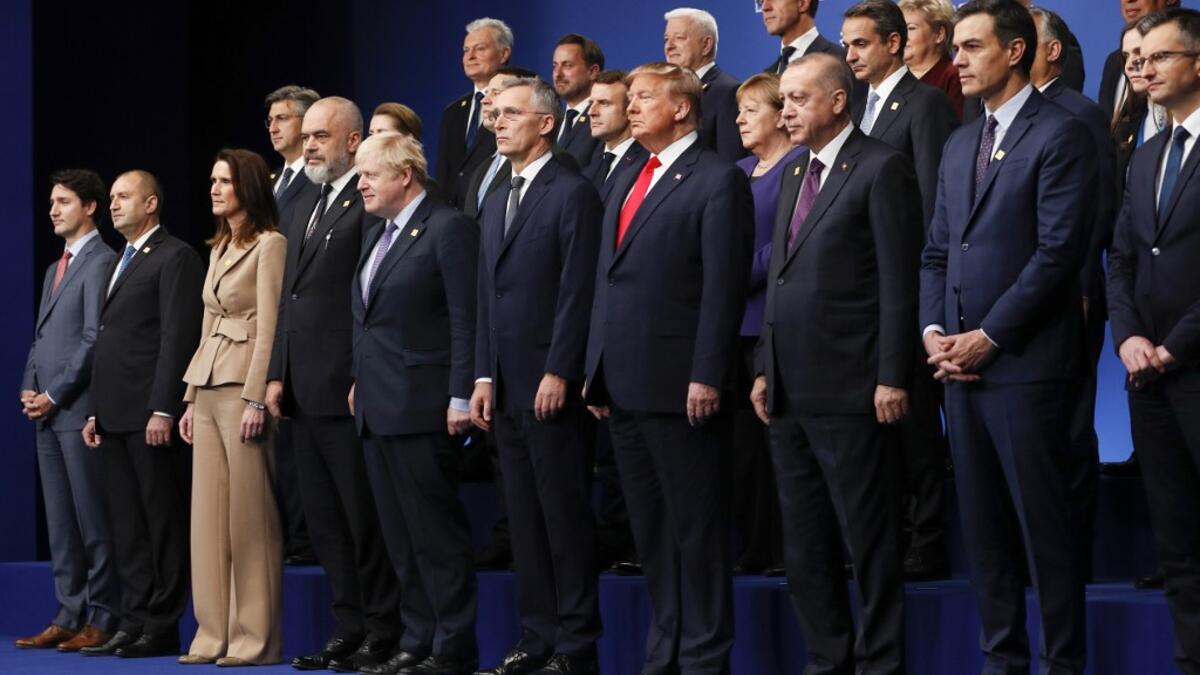 Nato heads of government (front row L-R): Canada's Prime Minister Justin Trudeau, Bulgaria's President Rumen Radev, Belgium's Prime Minister Sophie Wilmes, Albania's Prime Minister Edi Rama, Britain's Prime Minister Boris Johnson, NATO Secretary General Jens Stoltenberg, US President Donald Trump, Turkey's President Recep Tayyip Erdogan, Spain's Prime Minister Pedro Sanchez, Slovenia's Prime Minister Marjan Sarec, (middle row L-R) Croatia's Prime Minister Andrej Plenkovic, Denmark's Prime Minister Mette Fre