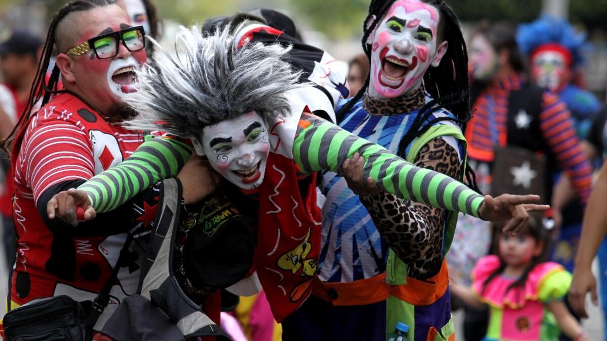 A group of clowns play during the International Clown Day in Guadalajara, Mexico, on December 10, 2019. Ulises Ruiz / AFP