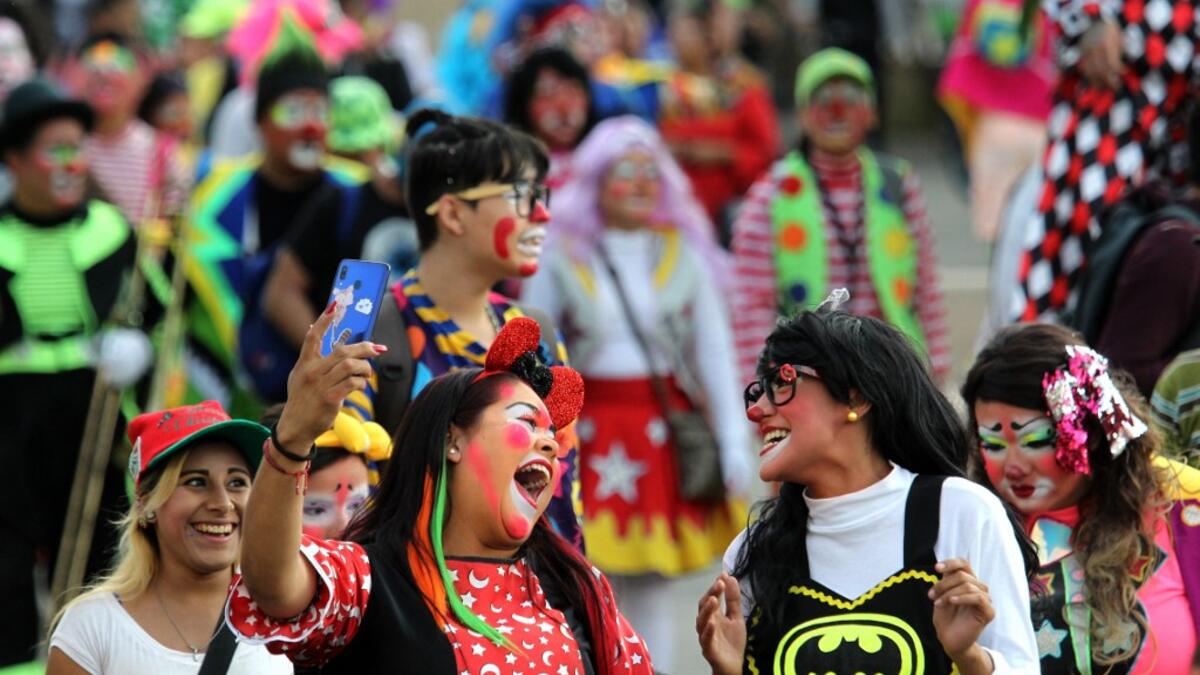 A group of clowns play during the International Clown Day in Guadalajara, Mexico, on December 10, 2019. Ulises Ruiz / AFP