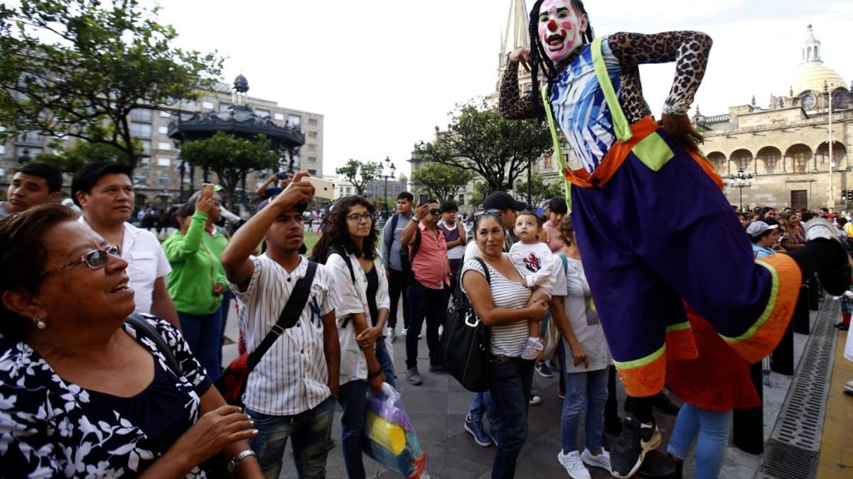 A group of clowns play during the International Clown Day in Guadalajara, Mexico, on December 10, 2019. Ulises Ruiz / AFP